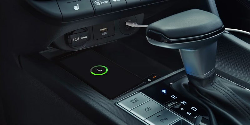 Close-up of a Hyundai Elantra center console with gear shifter and control buttons.