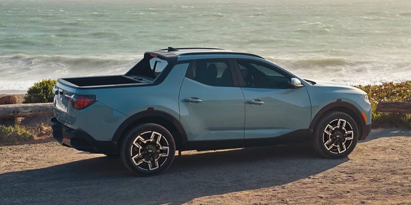 Hyundai Santa Cruz cruising by the seaside.